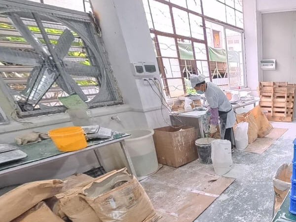 Workers Mix Raw Materials On Diatomite Scent Stone Production Line